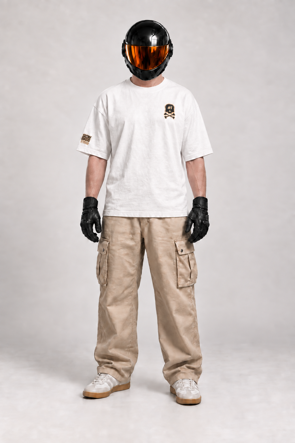 Front view of SVO wearing the white ISSUE #1 SKULL oversized T-shirt with beige cargo trousers.