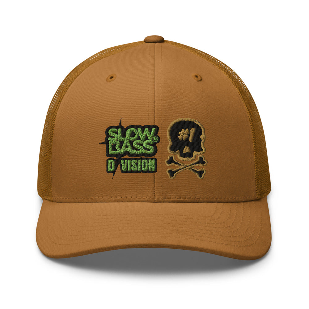 Front view of the caramel SBD #1 trucker cap, showing the embroidered green logo and black and gold Issue #1 skull.